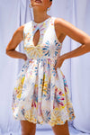 Close up of woman wearing Tie Dye Bubble Mini Dress by Australian designer Isabella Longginou. 